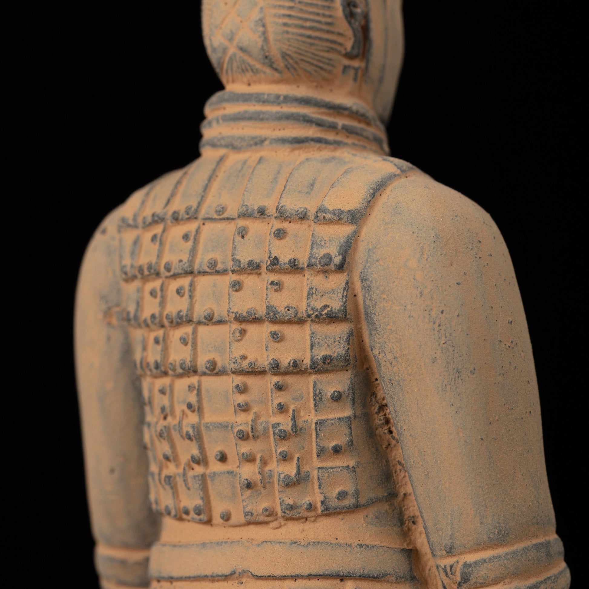 15CM Cavalryman - CLAYARMY-Close-up of the 15CM Terracotta Army Cavalryman's face, revealing intricate armor details and a distinct flat bun hairstyle.