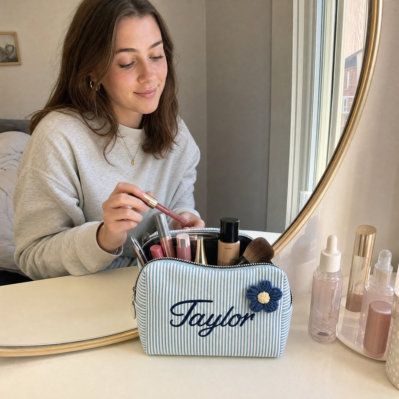 Woman using a personalized corduroy makeup bag with custom name Taylor at a vanity