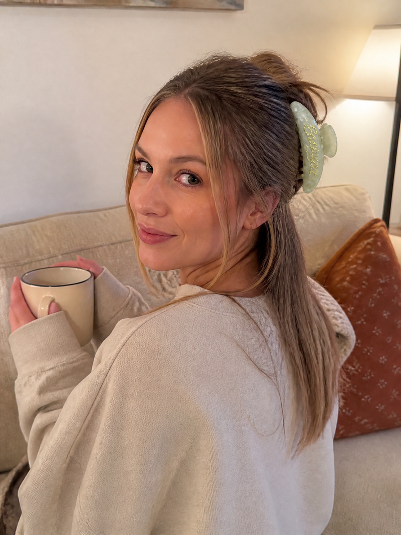 Woman wearing a personalized hairclaw while relaxing at home