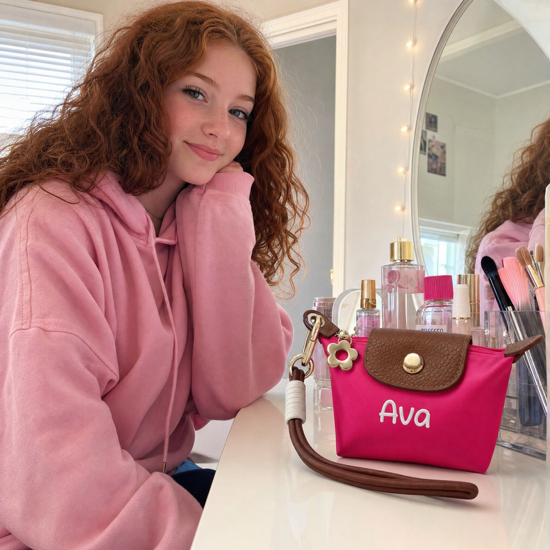 Woman holding a personalized pink coin pouch with custom name Ava while getting ready